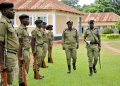 Inspector General of Police Abas Byakagaba inspects the parade of officers ready to begin their development-focused training.