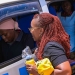 Sylvia Mulinge, the MTN Uganda's Chief Executive Officer engaging with passengers at the New Taxi Park at the launch of the new Kabode Supa