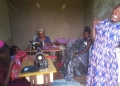 Some of the beneficiaries showcasing one of her  products.