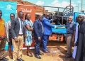 Martin Lukyamuzi (center), PostBank's Regional Head of Distribution for Greater Kampala, and Mufti Muhammad Kadala (third from right) of Masjid Swaleh, Bombo, pose with representatives from PostBank and Swaleh Masjid during an Eid al-Adha celebration today, May 28, 2025. PostBank shared joy with Muslim communities in Bombo and other regions, donating cows and goats through its branches in Arua, Mbale, and Fort Portal for the upcoming festivities.