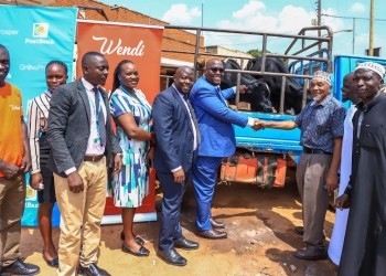 Martin Lukyamuzi (center), PostBank's Regional Head of Distribution for Greater Kampala, and Mufti Muhammad Kadala (third from right) of Masjid Swaleh, Bombo, pose with representatives from PostBank and Swaleh Masjid during an Eid al-Adha celebration today, May 28, 2025. PostBank shared joy with Muslim communities in Bombo and other regions, donating cows and goats through its branches in Arua, Mbale, and Fort Portal for the upcoming festivities.