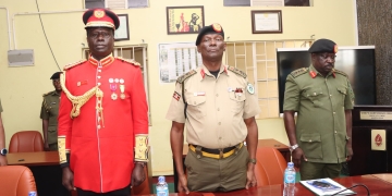 L-R: Maj. Gen. Francis Okello, Maj. Gen. George Igumba, and Lt. Gen. Peter Elwelu prepare for documentation at Mbuya