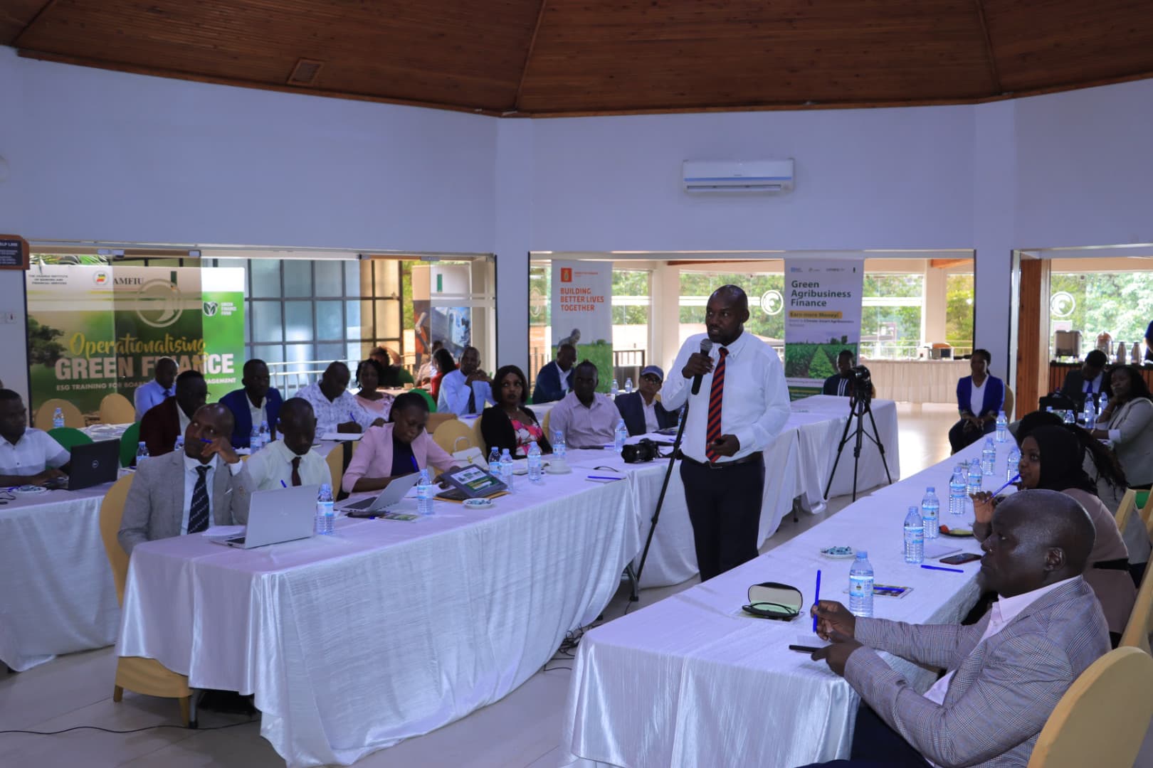 Participants actively engaged in a training session led by aBi Finance and UIBS in Kampala, focused on integrating ESG principles into Uganda's financial sector.