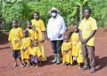 President Yoweri Kaguta Museveni in a group photo with Muhereza Wako a Parish Development Model (PDM) beneficiary and his family during the Presidential PDM assessment tour of the Greater Mukono. Muhereza Wako ventured in Dairy farming and operates a cassava milling machine on one acre in the village called Buyego cell, Buvuma Town council, Buvuma Sub County in Buvuma district. Photo by PPU/ Tony Rujuta.