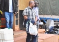 The accused person (in checkered shirt) at City Hall court on Friday.