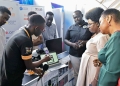 Ugandan Minister Monica Musenero and Col. Edith Nakalema urge citizens to embrace local science, technology, and innovation for national development during the first National Science Summit in Kampala.