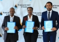 Mr. Halfani R. Halfani, Board Chair for PURA (L), Ms. Lynda Biribwona, PAU Board Chairperson,(C), Mr. Muhammed S. Said, the Managing Director of ZPRA (R) shortly after the signing ceremony at Petroleum House, Entebbe.