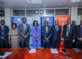 Finance Minister Matia Kasaija (C) and State Minister Evelyn Anite (4th L) join PostBank Uganda's Chairman Andrew Otengo Owiny (3rd R) and MD Julius Kakeeto (3rd L) with other officials at the bank's 2024 AGM in Kampala today. Shareholders commended PostBank's strong performance, celebrating a UGX 35.4 billion profit after tax and its position as one of the most profitable government entities.
