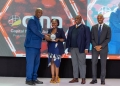 A team from SBG Securities led by the Chief Executive, Grace Semakula (right), posing for a photo after receiving the award