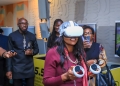 Yolanda Cuba, MTN Group Vice President for Southern and East Africa, joins the MTN Uganda team to test new technology at the company’s headquarters in Kampala.