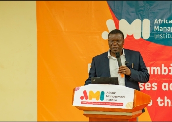 Johnson Abitekaniza, Assistant , the Commissioner in charge of training and skills development at the Ministry of Trade and cooperatives addressing participants.