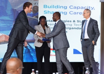 Valerian PFRIMMER, Managing Director for East and South Africa at SLB hands over the programme implementation agreement to Prof. Jude T. Lubega the Vice Chancellor of Nkumba University