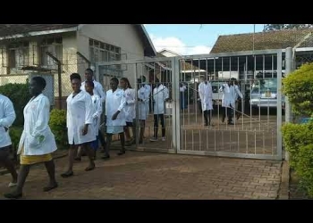 Medical lab association defends Ugandan principal over pregnant student's discontinuation, asserting adherence to existing health training regulations.
