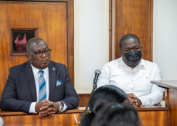 David Balondemu (left) and his co-accused appear in court during a hearing in Kampala.