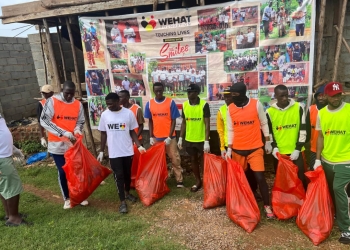 Some of the participants engaging in a cleaning exercise in Busabala, in preparation of the football tournament
