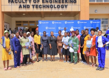 The Stanbic team together with Busitema University staff led by the Vice Chancellor Prof. Paul Waako(in suit), posing for a photo with some of the graduates.