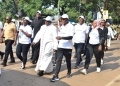Archbishop of Kampala Archdiocese, His Grace Paul Ssemwogerere, Fabian Kasi, Managing Director, Centenary Bank (R) and other walkers during the Nsambya Babies Home Charity Walk.