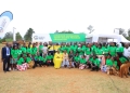 EACOP Social Performance Manager, Rosie Birungi(brown coat), Shartsi Musherure(Yellow dress), Member of Parliament, Mawogola North constituency, having a photo moment with some of the graduates under the EACOP youth livelihood program that facilitates the skilling of youth from project-affected households as part of the Resettlement Action Plan (RAP).