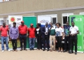 Sheila Awori,(2nd R), Ag. Head of Marketing and Communications KCB Bank Uganda poses for a photo with some of the members of FMU , the drivers and other sponsors of the upcoming Fort Portal rally at its launch.