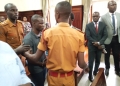 Bobi Young (in middle) at High Court on Monday