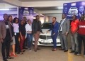 Representatives from Uganda Law Society New Radical Bar , Advocate Muhwezi with his friends having a photo moment at his brand new Mercedes Benz