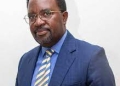Eng. John Mary Vianne Twinomujuni has caused a storm by trying to cling on to office despite clocking mandatory retirement age