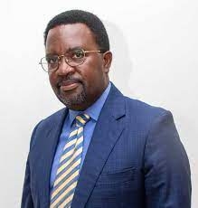 Eng. John Mary Vianne Twinomujuni has caused a storm by trying to cling on to office despite clocking mandatory retirement age