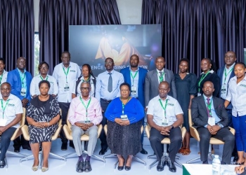 Panelists representing government and nonprofit organizations on a panel discussion at a conference in Kampala, Uganda, discussing improvements in education.