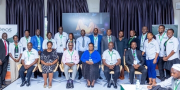 Panelists representing government and nonprofit organizations on a panel discussion at a conference in Kampala, Uganda, discussing improvements in education.