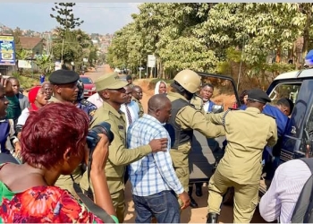 Police men leading Nubian Li in the Police Patrol outside E.C offices on Tuesday.