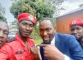 Kalyango Baker (in red overall) with NUP Deputy Spokesperson Waiswa Mufumbiro early this year.
