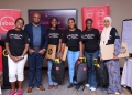 Members of team code forces (holding their gifts) pose for a photo moment with Absa Bank Uganda representatives after the Hackathon