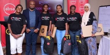 Members of team code forces (holding their gifts) pose for a photo moment with Absa Bank Uganda representatives after the Hackathon