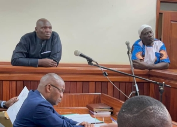 Former Senior Superintendent of Police Nickson Agasiirwe and former operative Abdunoor Ssemujju at the Nakawa Chief Magistrate’s Court. (Photo/Henry Jjemba)