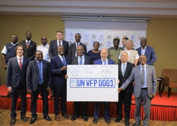 Uganda and WFP sign a historic pact establishing unique UN/WFP license plates in Kampala to eliminate red tape and speed up life-saving aid delivery across Africa.