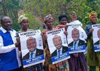 Supporters of Francis Mwijukye hold up his campaign portraits during a rally in Buhweju District ahead of the 2026 general elections. Mwijukye, a veteran legislator representing the People Front for Freedom, lost his seat in the polls after serving 15 years in Parliament.