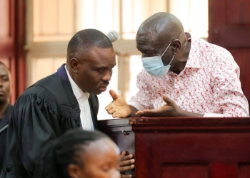Col (Rtd) Dr. Kiiza Besigye with his lawyer Erias Lukwago in court today.