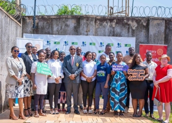 Group photo with the District Governor Rtn Geoffrey Kitakule following the community library launch