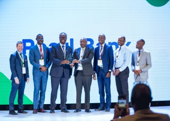 Brian Milder (left), CEO of Aceli Africa, and John Robert Okware (second from left), Aceli Africa country director, present the Best Agri-SME Lender award to Julius Kakeeto (third from left), managing director of Pearl Bank Uganda, and Martin Mugisha (center), executive director of operations at Pearl Bank. They are joined by officials from both organizations during the Aceli Africa Uganda Stakeholder Roundtable on Feb. 11, 2026, at Four Points by Sheraton in Kampala.