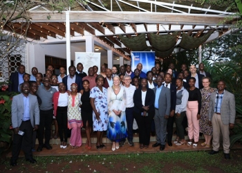 British High Commissioner Lisa Chesney, center, poses for a group photo with members of the Commercial Coffee Producers Association of Uganda and coffee industry stakeholders following the organization's launch in Kampala.