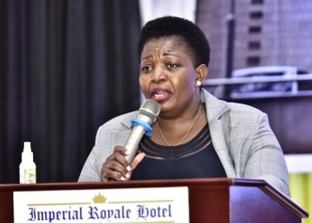 Minister for General Duties Justine Kasule Lumumba presents the 2025 local government performance assessment results during the National Performance Review Conference at Speke Resort Munyonyo. Lumumba noted that overall service delivery improved to 67.23 percent, with water and sanitation emerging as the top performing sector.