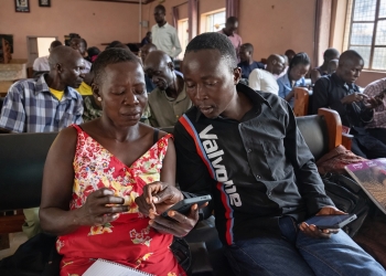 Participants learn how to operate newly acquired smartphones during a digital health training session in Gulu on Wednesday. The devices, provided by the Ministry of Health with support from UNFPA and Marie Stopes, are part of a rollout to digitize community health data collection for Village Health Teams in northern Uganda. PHOTO/David Okema