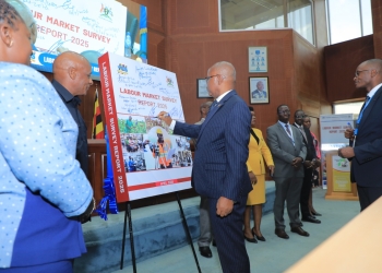 Uganda Bureau of Statistics Executive Director Chris Mukiza signs the Labour Market Survey 2025 report at the bureau headquarters in Kampala on Thursday. The survey provides a comprehensive look at the country's labor supply and demand, revealing that nearly 90 percent of workers remain in the informal sector.