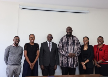 DPP Lino Anguzu (in a tie) next to Mr. Allan Kasujja right and other members of staff from ODPP and Media Center.